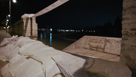 sandbags stacked along a riverside walkway as a flood barrier during the budapest flood 2024