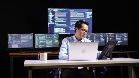 programmer working at a computer desk