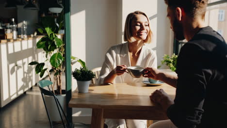 couple enjoying coffee in a cafe