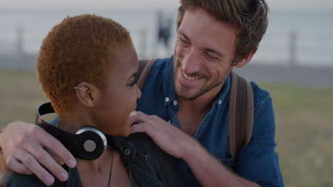 portrait attractive young man surprise hugging african american girlfriend multi ethnic couple enjoying happy relationship smiling together on seaside slow motion