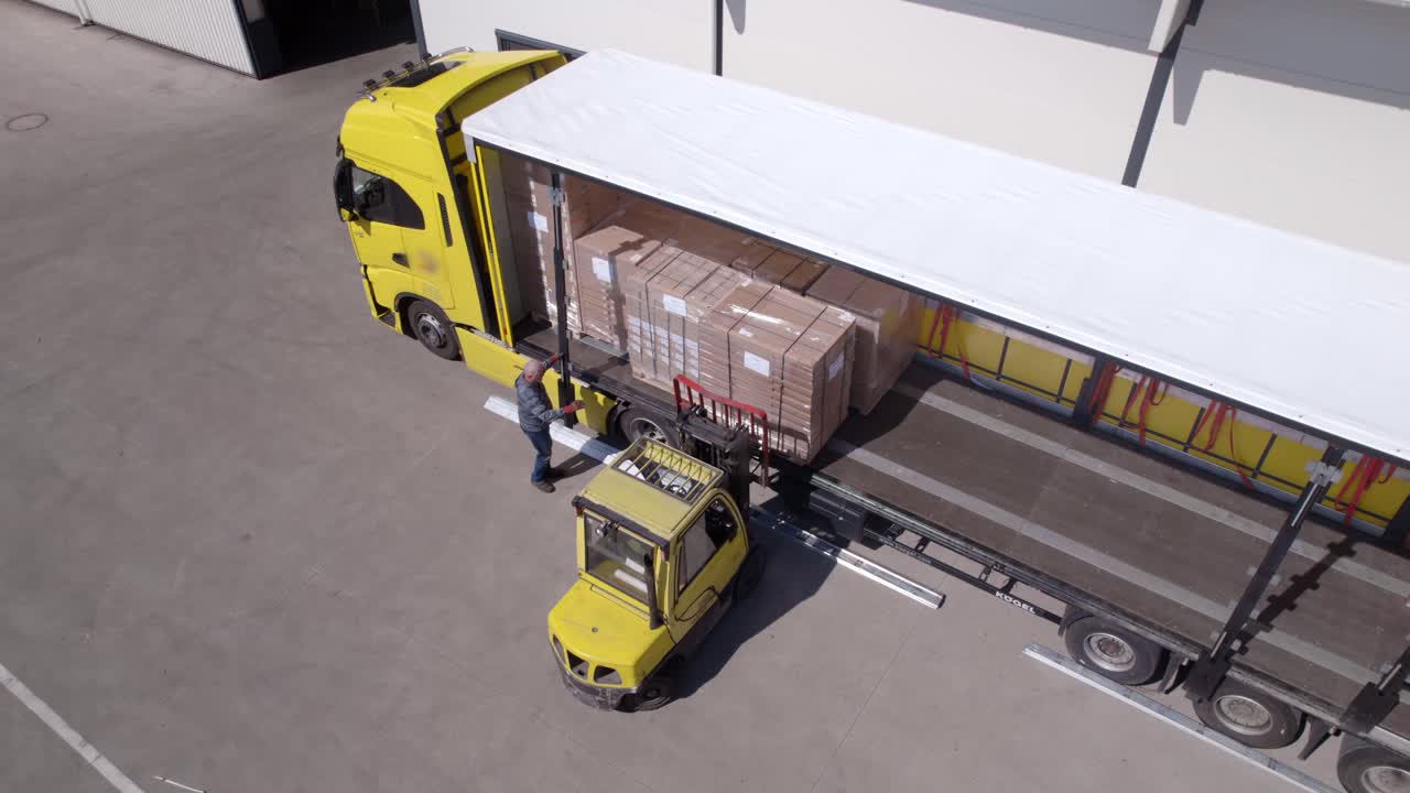 Forklift Loading Truck Trailer with Cardboard Boxes