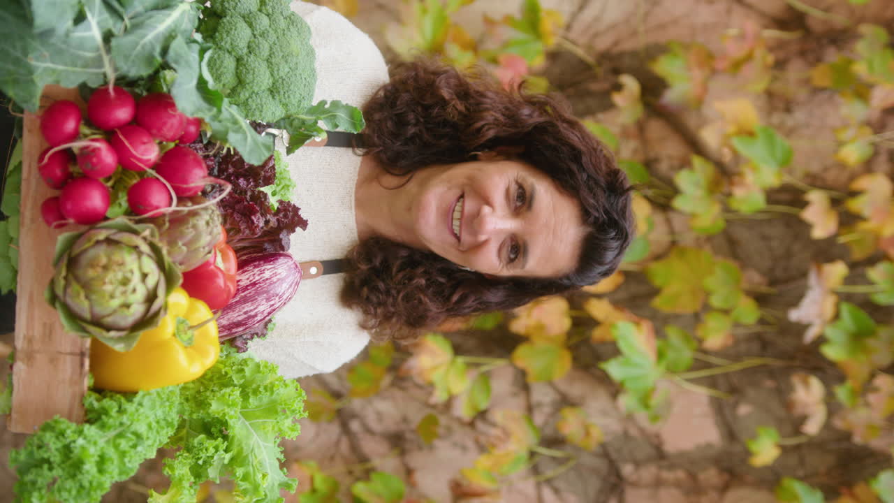 Woman with fresh garden vegetables