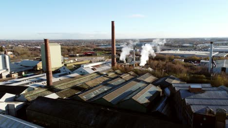 pilkington glass factory warehouse buildings aerial view flying over industrial town manufacturing facility