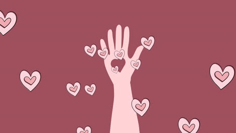 animación de corazones y mano sobre fondo rosado