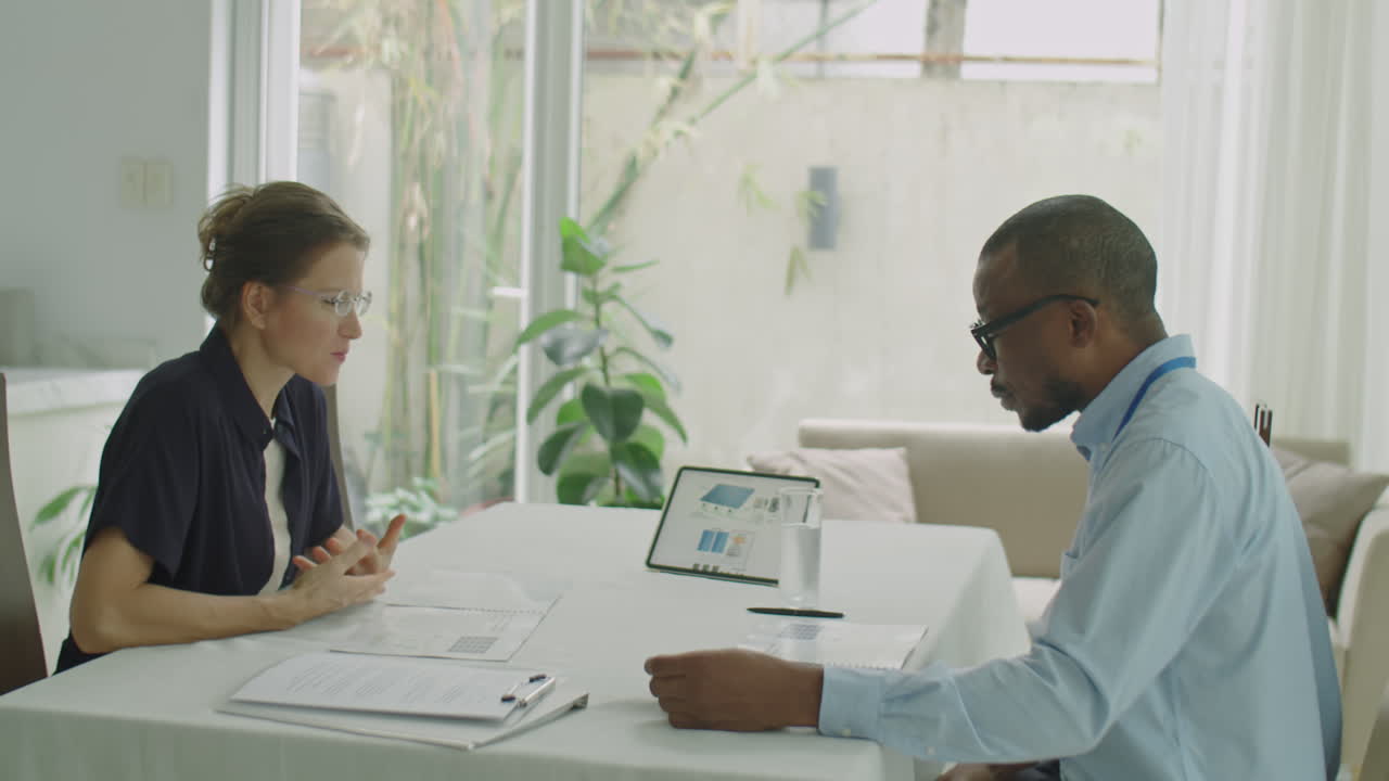 Multi-Ethnic Engineer and Businesswoman Shaking Hands on Meeting