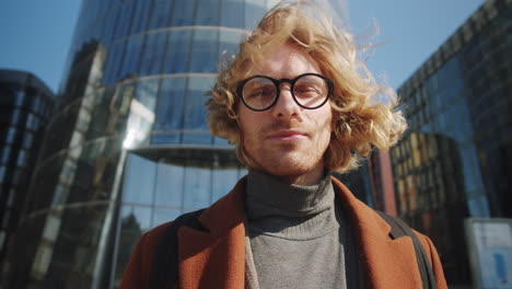 portrait of young handsome businessman in downtown