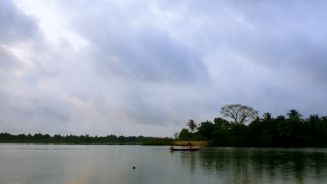 Silhouette-of-Fisherman-rowing-boats-and-heading-for-catching-fish-during-early-morning