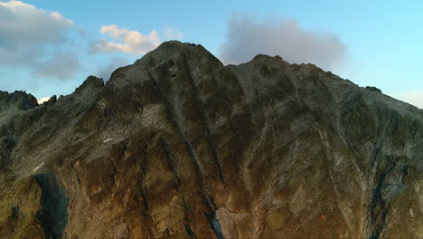 picturesque view over rocky mountains peak at dusk