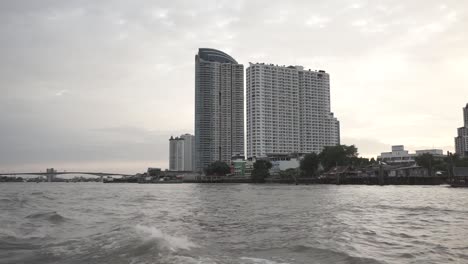 Passing trough the river, over the building, by boat