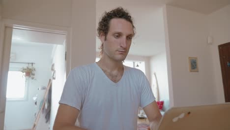 man working on a computer at home