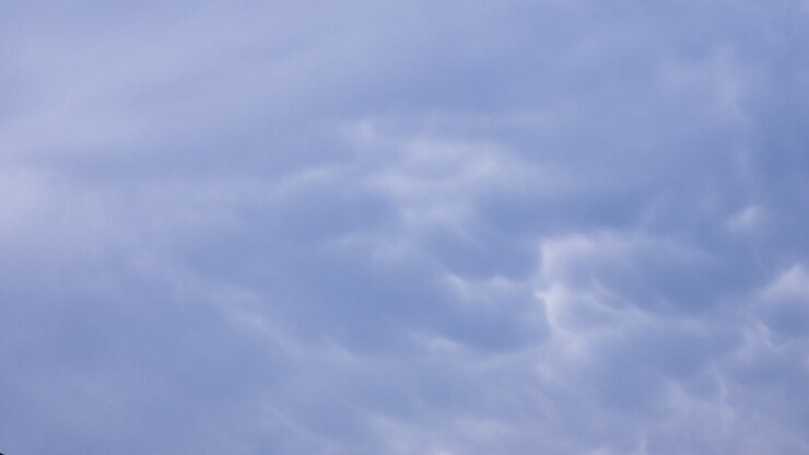 Moody blue grey mammatus clouds swirling overhead after a big storm - time-lapse