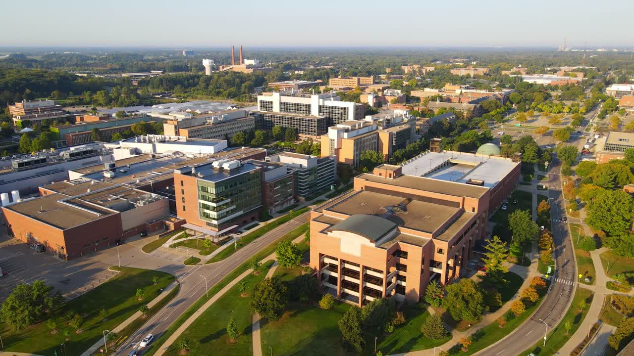 Michigan State University complex buildings on sunny day, aerial view
