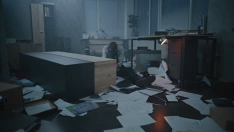 overwhelmed employee in a messy office