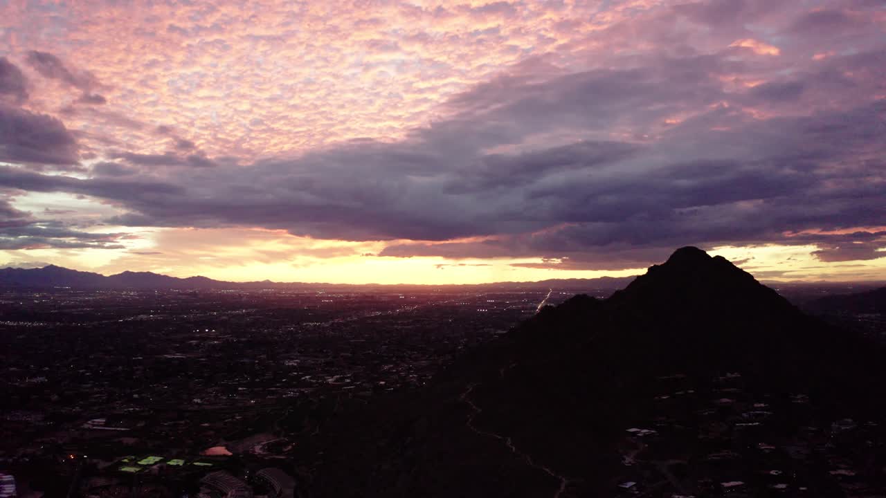 Drone shot of Camelback Mountain surrounded by Arizona's sunset