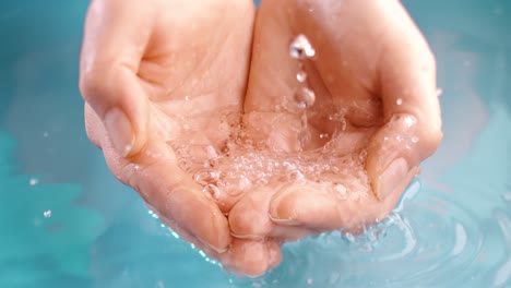 hands cupping water