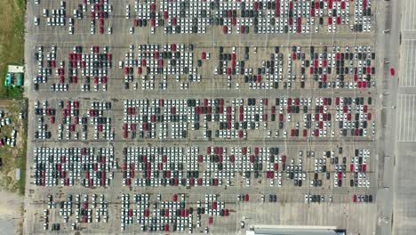 Aerial-drone-footage-of-different-colored-cars-parked-in-a-huge-parking-of-a-shopping-center-in-Argentina