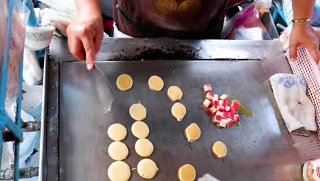 cooking crab stick pancakes on a hot griddle