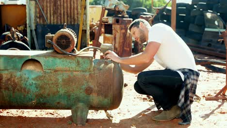 man working on vintage machine 4k