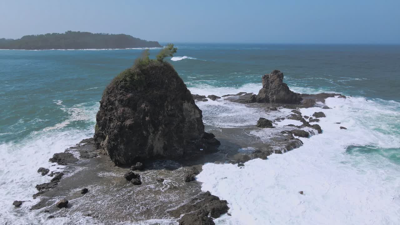 Aerial drone's circular view of Watu lumbung beach