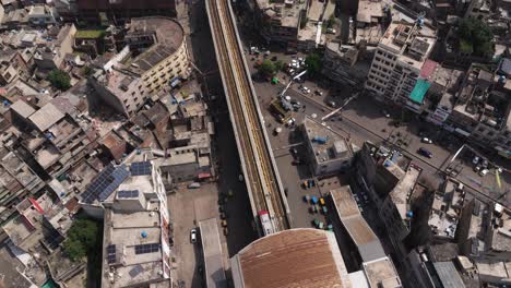 Subway Train Departs Station in Crowded City - Lahore, Pakistan