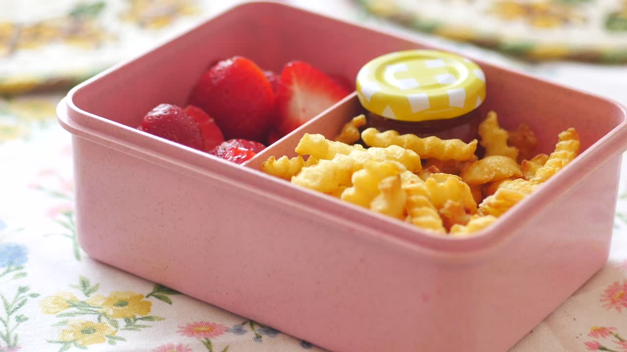 Bento box with strawberries and fries