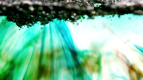 Water-bubbling-in-green-blue-pool