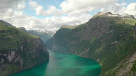 Picturesque-Panorama-Of-Geiranger-Fjord-And-Skagefla-Mountain-Farm-On-Steep-Hillside-From-Ornesvingen-Viewpoint-In-Valldal,-Norway