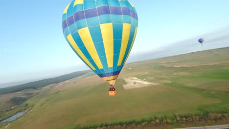 hot air balloons over scenic landscape