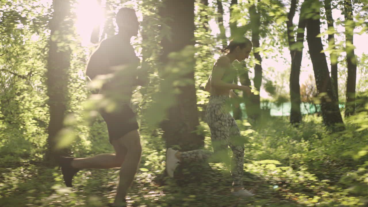 People exercising and running in the forest