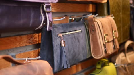 a display of leather bags in a shop