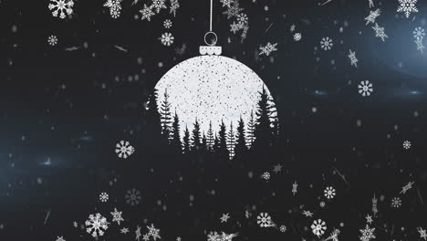 Snowflakes-falling-over-christmas-bauble-decoration-hanging-against-black-background