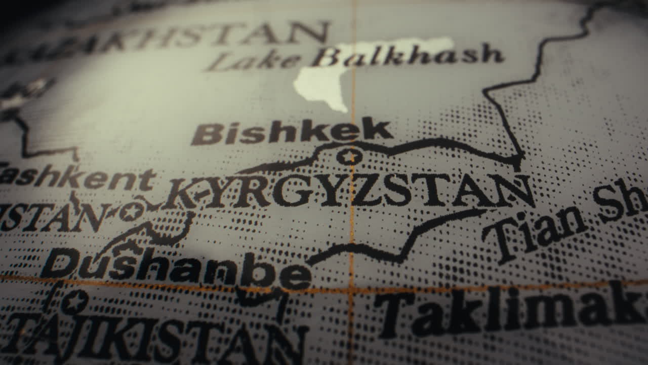 Close-up of a vintage world map focusing on Kyrgyzstan and surrounding regions.