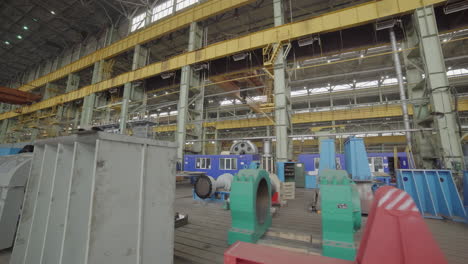 large industrial facility with machinery and people