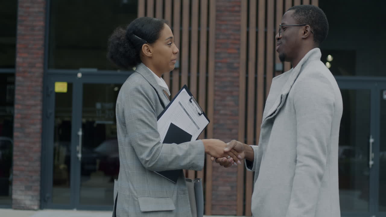 Businesspeople shaking hands and negotiating