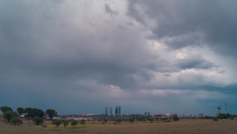 timelapse cloudy and stormy sky in madrid skyline during sunset day to night city lights