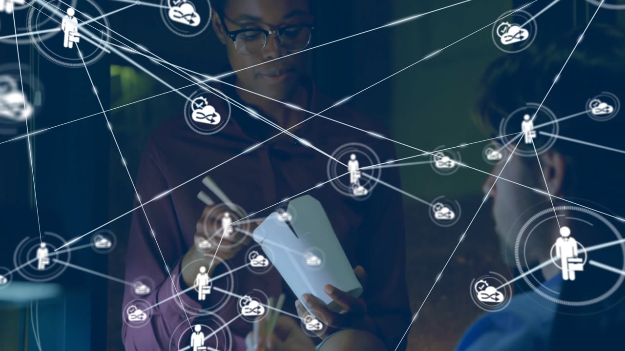Colleagues lifting chopsticks in office break, spawning icon and growing business network overlay