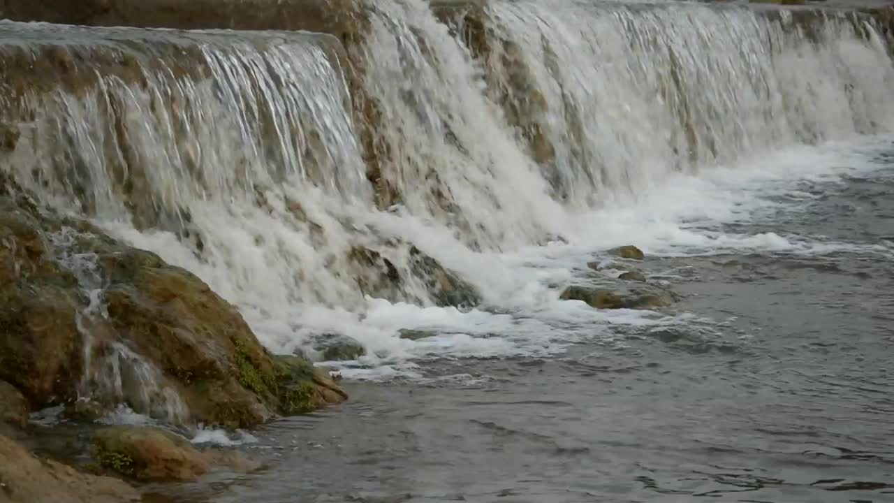 Catching a waterfall in a small freshwater channel.