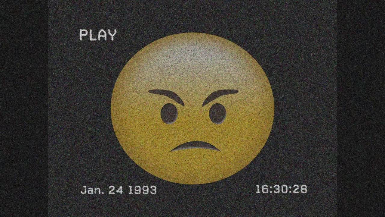 회색 배경에 화난 얼굴 이모티콘에 대한 vhs 장애 효과의 디지털 애니메이션