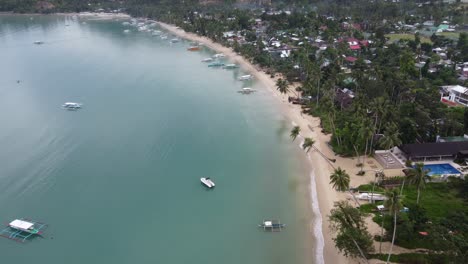 tropical beachfront of port barton seaside village with traditional boats at itaytay bay