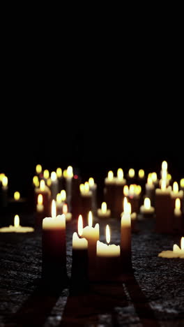 many lit candles on table