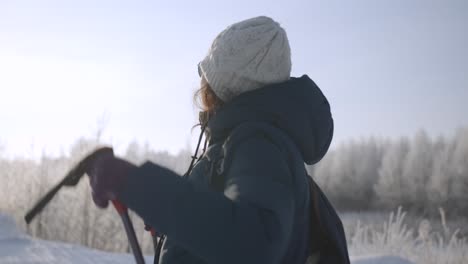 woman hiking in snowy forest