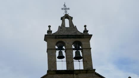 close-up of a church bell tower with two bells