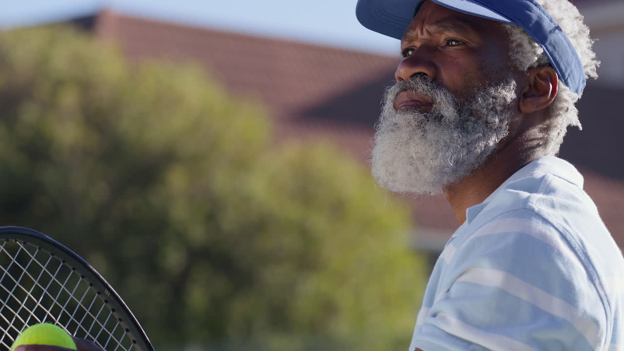 Senior man playing tennis