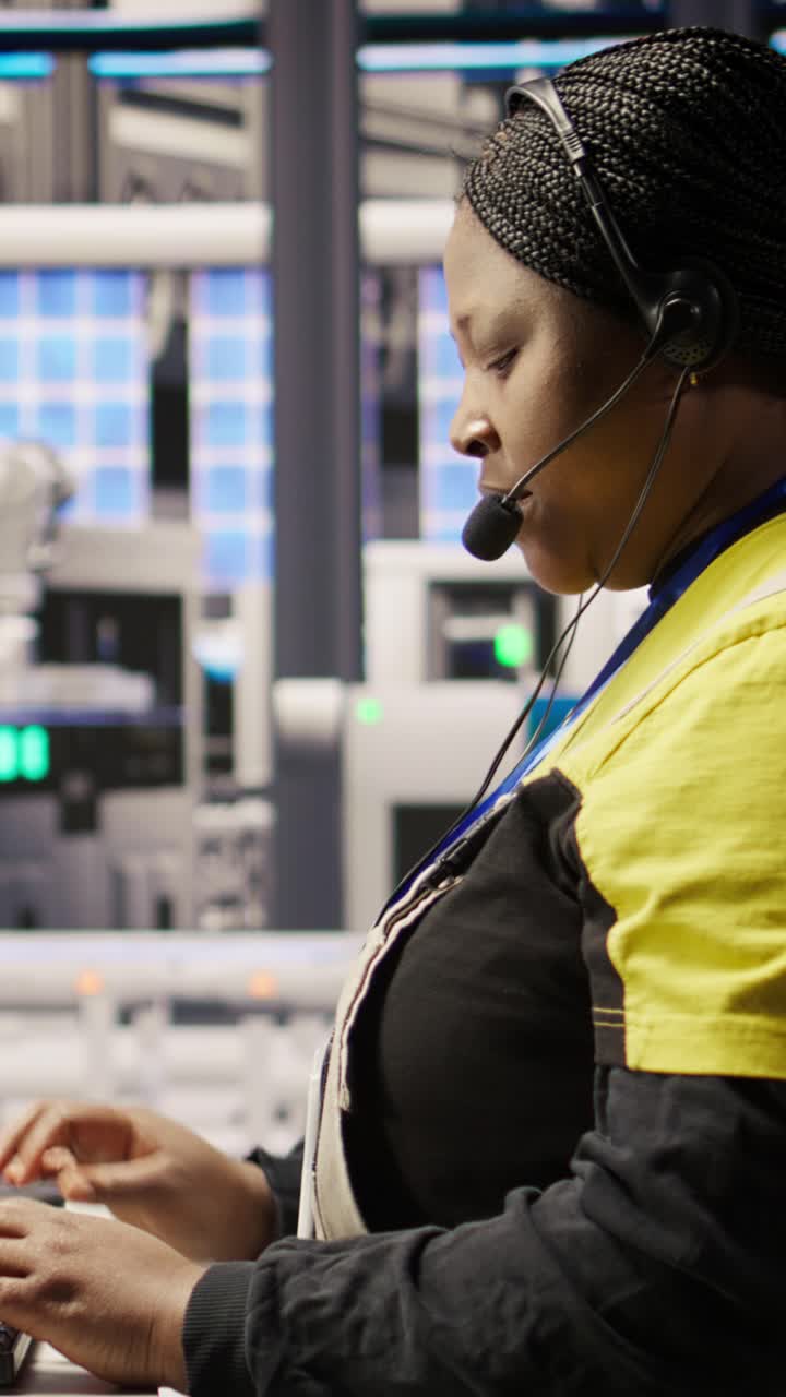 Vertical video Call center agent in smart factory using headset to assist with maintenance