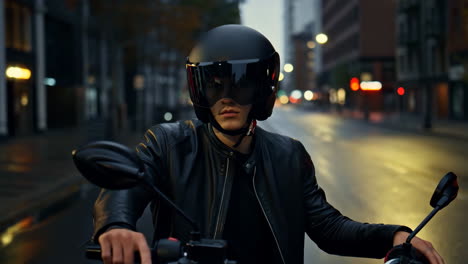 biker on motorcycle in urban night setting