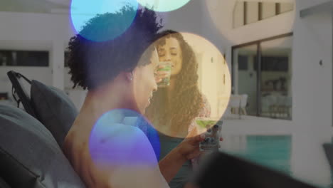 relaxing by poolside, people enjoying drinks with colorful bokeh animation