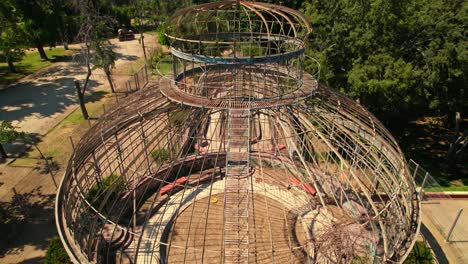 tilt down bird's eye view of the quinta normal greenhouse with rusted and abandoned art nouveau architecture - santiago chile