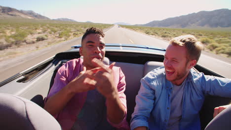 two male friends on road trip in convertible car shot on r3d