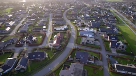 aerial shot of a charming small town in suburban denmark featuring residential areas and streets