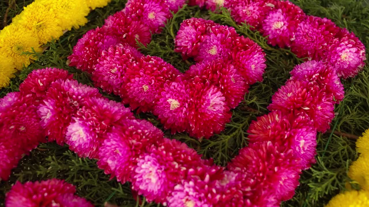 SLOW MOTION CLOSE UP SHOT OF A FLOWERS ARCH FOR A MEXICAN PARTY